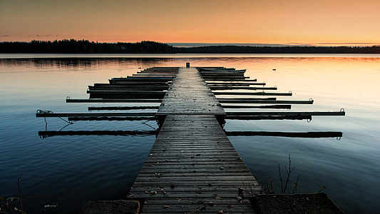 gray wooden dock on body of wter thumbnail
