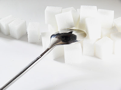 silver spoon on sugar cube thumbnail