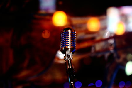 selective focus photography of black condenser microphone thumbnail