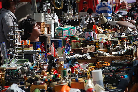 man sitting in the middle of toys thumbnail
