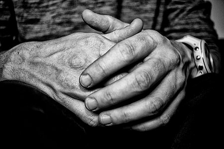 grayscale photo of man's hand thumbnail