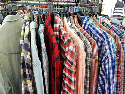 hanged assorted-color long-sleeved collared shirts inside store thumbnail