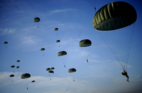 people parachuting in sky thumbnail