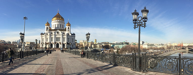 people walking near dome building taken under white clouds thumbnail
