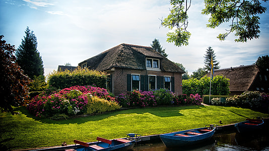 brown house on green grass field thumbnail