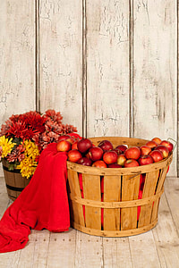 bucket of Apples beside bucket of Chrysanthemum flowers thumbnail