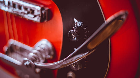 selective focus photography of guitar whammy bar thumbnail