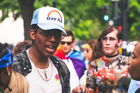 Man With White Crew-neck Shirt Beside Woman With Multicolored Shirt at Daytime thumbnail