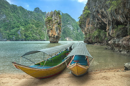 two brown-and-blue boats thumbnail