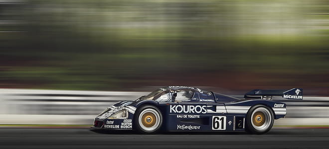 Time Lapse Photography of Black and White Kouros Racing Car thumbnail