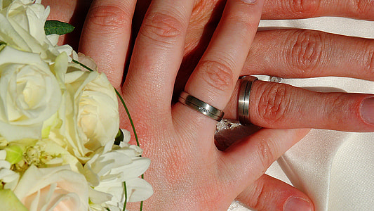 two hands with silver rings thumbnail