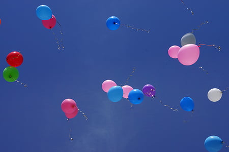 assorted-color balloons at sky thumbnail