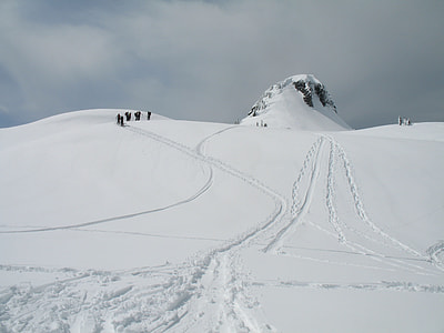 people waking on snow capped field thumbnail
