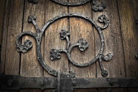black metal and brown wooden board thumbnail