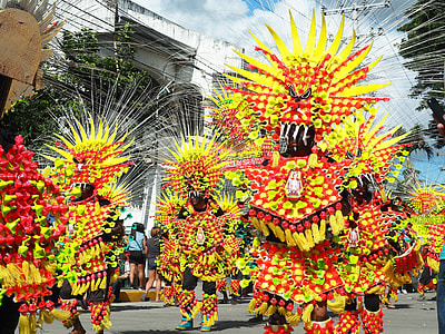 people in costume parading on street thumbnail