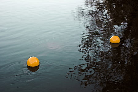 two yellow plastic balls thumbnail