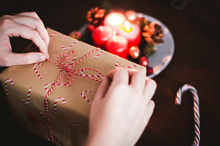close-up photography of person holding gift box thumbnail
