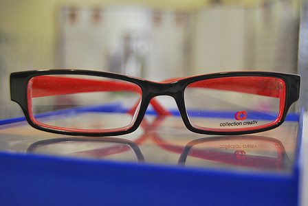 eyeglasses with black frames on shallow focus lens thumbnail