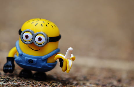 close-up photography of Minion holding banana plastic toy thumbnail