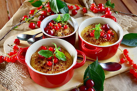baked food in three red ceramic two handled mugs thumbnail