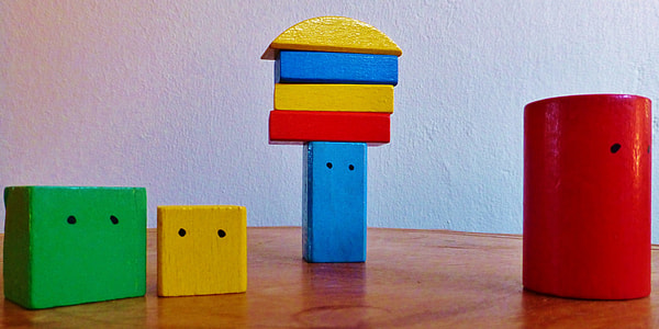 assorted-color wooden block toy on panel board thumbnail