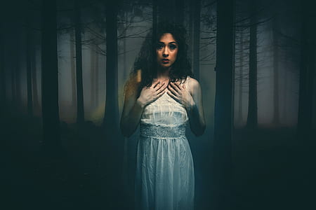 woman standing under tree at forest thumbnail