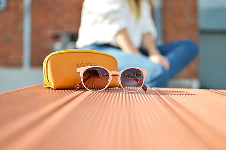 sunglasses on brown surface thumbnail