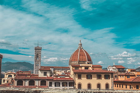white and brown concrete cathedral under clear blue sky during daytime thumbnail