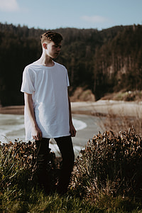 man standing outdoor near body of water thumbnail