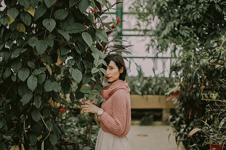 woman standing near green leafed tree thumbnail