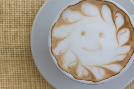 white ceramic cup with cappuccino on white saucer thumbnail