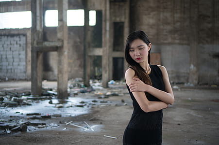 woman in black sleeveless dress thumbnail