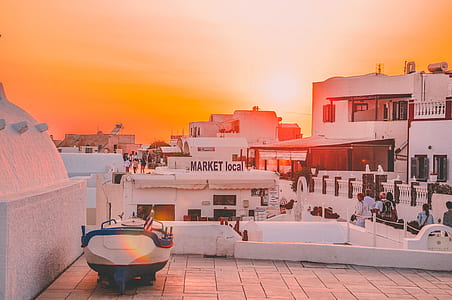 white and blue boat decor on white building thumbnail