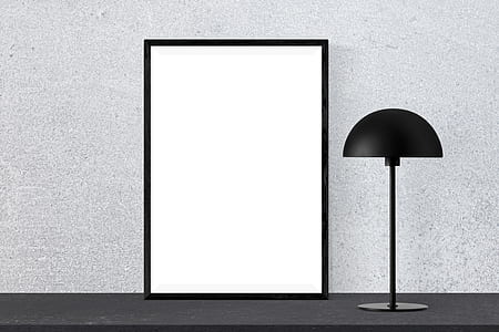 white wooden photo frame and black desk lamp thumbnail