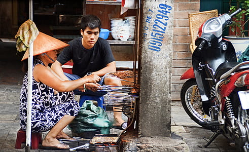 Photography of Man and Woman Grilling Food thumbnail