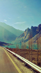 asphalt road near mountains thumbnail