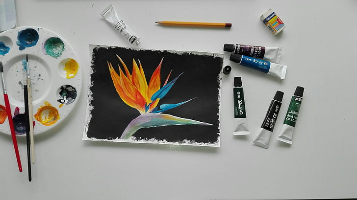 yellow and blue petaled flower painting beside soft-tube