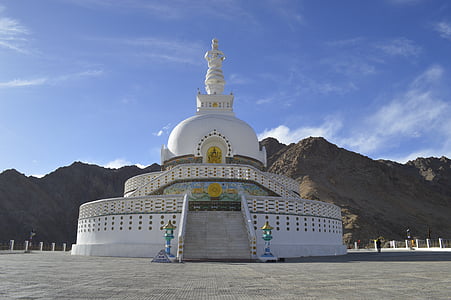 white temple near mountain thumbnail