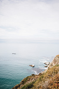 photo of rock formations on body of water thumbnail