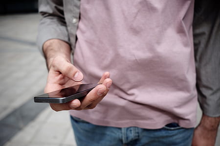 person holding black phone thumbnail