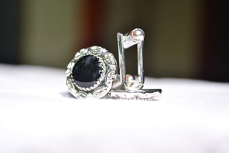 silver-colored earring thumbnail
