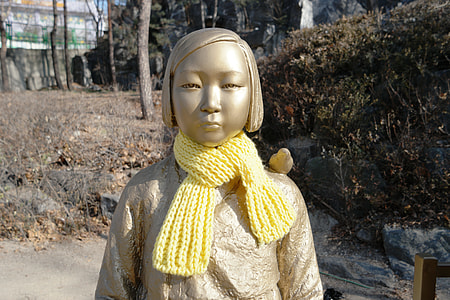girl statue with yellow scarf thumbnail