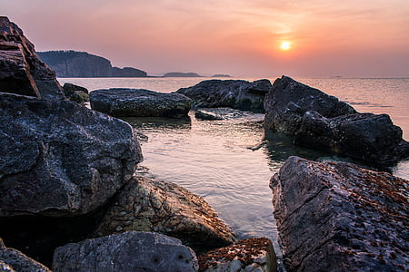 rocky shore during sundown thumbnail