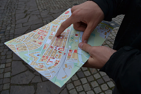 person holding map thumbnail