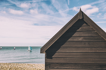 Summer beach hut house on the coast on a sunny summer day thumbnail
