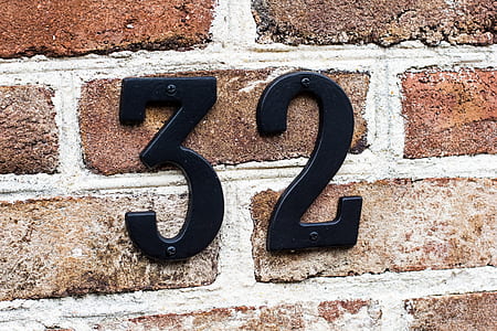 black number 32 mounted on wall thumbnail