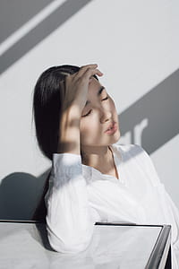 woman holding her hair thumbnail