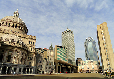 high rise buildings under white clouds at daytime thumbnail