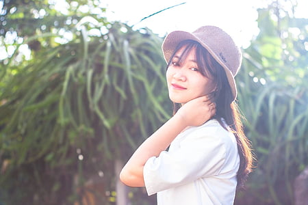 woman wearing white short-sleeved top thumbnail