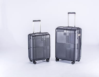 two grey luggage trolley bags on white surface thumbnail
